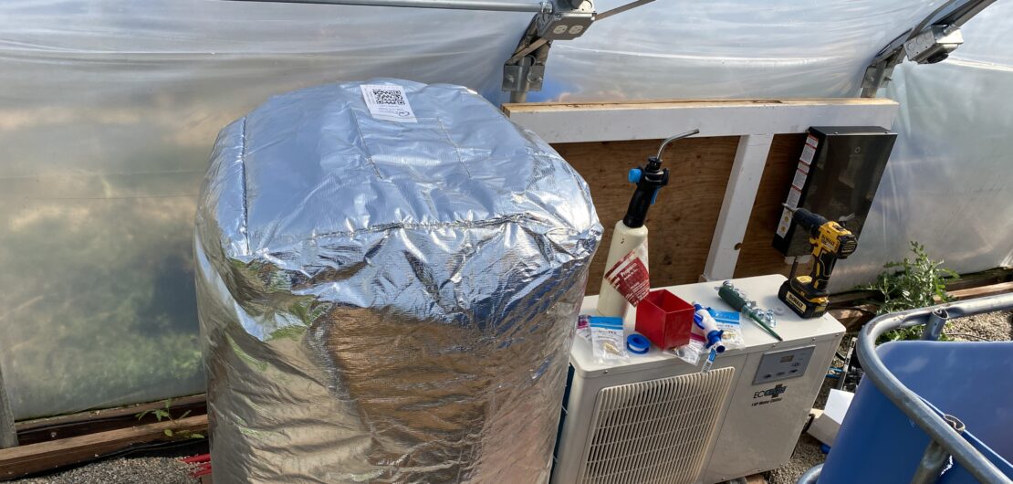 Heat exchange system showing insulated water barrel, water chiller, and on-demand water heater.